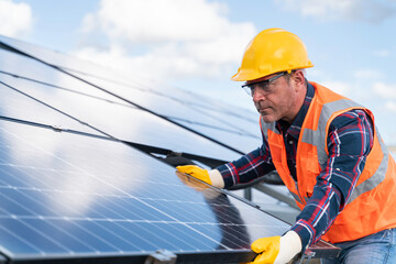 Installation of solar panels on solar panel plant.