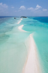 stunning blue ocean and sandy white island maldives top drone aeral view deserted hidden Maldives beach copyspace for text