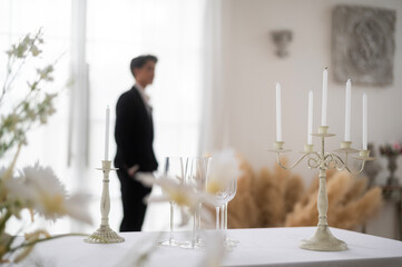 Wedding candle decoration in engagement ceremony, groom standing background