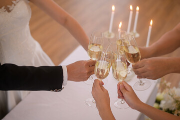 close up of Hands holding glasses of champagne at the wedding ceremony
