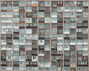 Old facades of brutalist soviet socialist buildings. The gloomy balconies of Russian flats.