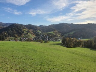 Beautiful slovenia: idyllic landscape with gently green rolling hills and a clear blue sky near Poljane nad Skofjo Loko