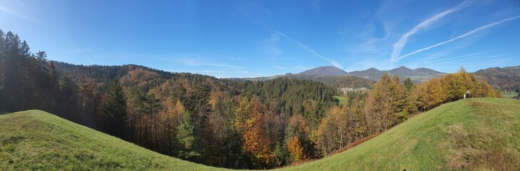 Beautiful slovenia: idyllic landscape with gently green rolling hills and a clear blue sky near Poljane nad Skofjo Loko