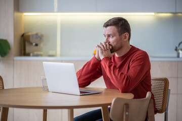 Naklejka premium Frustrated depressed man with serious financial difficulties feeling burnout, apathy, problems with concentration at home. Worried alone middle aged male thinking about trouble in life, loss, divorce.