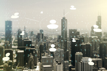Double exposure of social network icons hologram on Chicago office buildings background. Networking concept