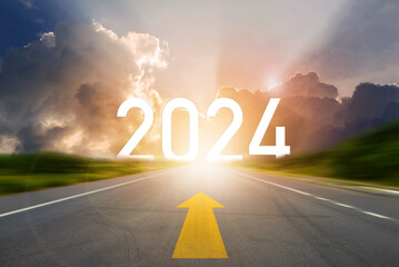 Go to the New Year 2024. Happy New Year greeting card 2024, 2024 letters on the highway road in the destination with arrow on asphalt road with sunset or sunrise light above asphalt road. - obrazy, fototapety, plakaty