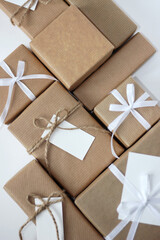 Wrapped and Decorated Gift Boxes with Ribbon Bows, Twine Bows and Gift Tags. Holiday Celebration. Gifts Packaging Design.
