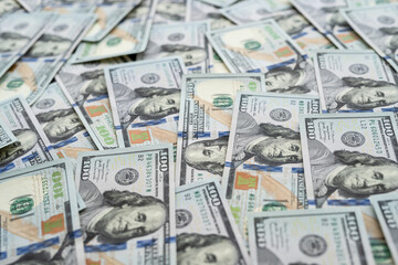 Finance background of new 100 dollar bills, pile of money. Us banknote