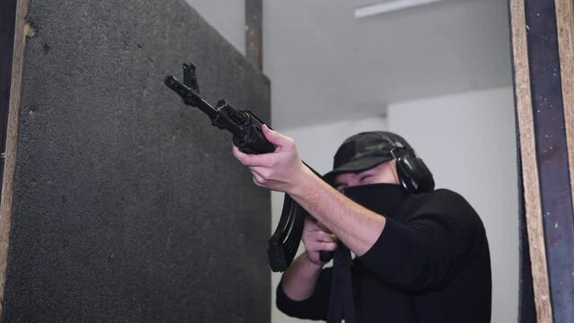 The special officer shoots from an AK 47 automatic rifle