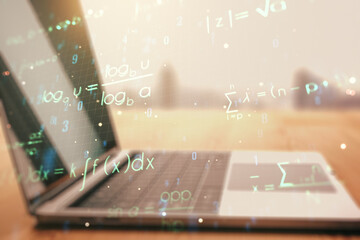 Double exposure of creative scientific formula concept on laptop background, research and...