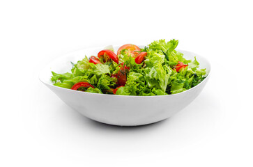 Side view of white bowl with vegetables isolated on white background. Green salad, dill, tomato.