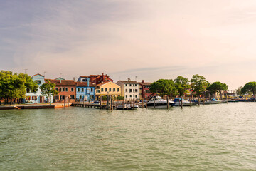 view of the town of Burano island colorful houses and port in venice italy