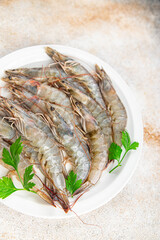 shrimp fresh langoustine raw prawn seafood fresh eating cooking appetizer meal food snack on the table copy space food background rustic top view 