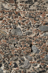 Old black stone wall closeup