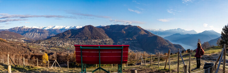 Big red bench on the alps of Lake Como