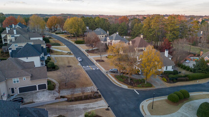 Aerial panoramic view of an upscale subdivision in suburbs of USA shot during golden hour in December 2023