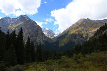 Fototapeta na wymiar Eighth stage of Ak-Suu Traverse trek from Ala-kol lake to Karakol Gorge in Karakol national park, Kyrgyzstan