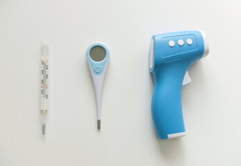 Best Thermometer for home. Three different types of thermometers on white background. Mercury,...