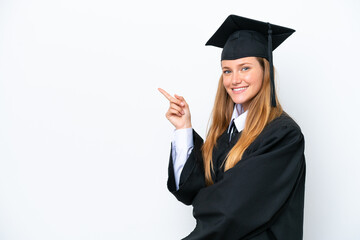 Young university graduate caucasian woman isolated on white background pointing finger to the side