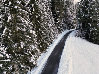 Winter road in snow covered forest, Black Forest, Baiersbronn, Germany.