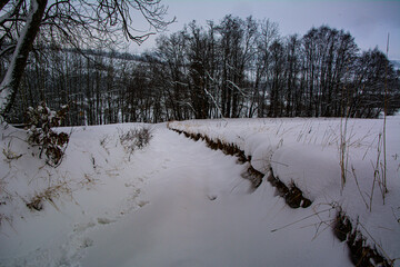 Winter road on Polish village