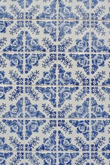 Traditional Portuguese tiles azulejos of blue colour with vintage ornate in Porto, Portugal