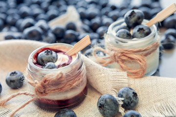 jars of yogurt with blueberries and chocolate