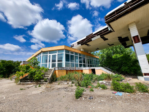 Old run-down gas station with gas pumps as a lost place in Wallachia in Romania