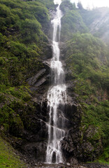 Fototapeta premium Waterfall on the Richardson Hw route, from Valdez to Fairbanks, Alaska, United States