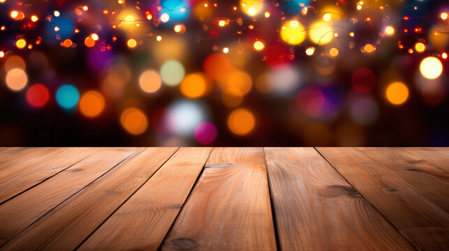 Beautiful blurred festive background with floor of dark brown wooden planks and with glowing garlands and bokeh effect. Winter seasonal decor, creating atmosphere of magical holiday. Copy space.