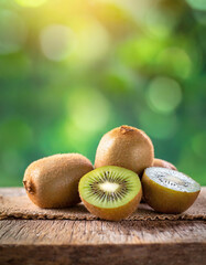 kiwi on the wooden in blur green background