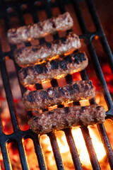 Cevapchichi is a type of kebab, a sausage made from ground meat with onions and spices, which is cooked on the grill.