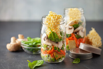 Healthy homemade instant noodles with vegetables in mason jar. Asian  vegetarian lunch idea