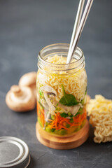 Healthy homemade instant noodles with vegetables in mason jar. Asian  vegetarian lunch idea. To-Go Miso Noodle Soup