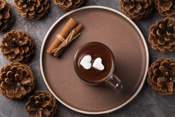Top view on a cup of hot chocolate with marshmallows on a dark table. Holiday Decorations.