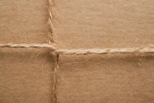 Top view of a craft gift box tied with twine, zero waste gift packaging close-up