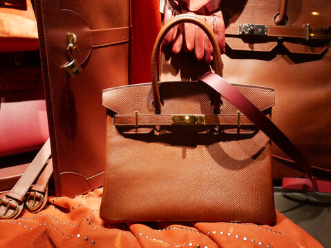 Luxury Hermes leather accessories on display in the historic store in Paris, rue du faubourg Saint Honoré. The mythical hanbag "Birkin".