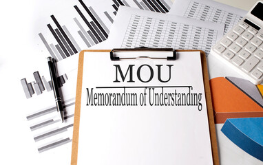 Paper with MOU Memorandum Of Understanding on a chart background, business