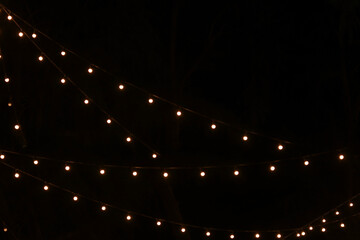 Tiny lights hanging in the dark