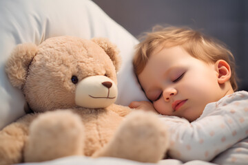 Young boy toddler sleeping with teddy bear
