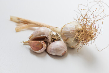 Garlic pestle with stem on white background.