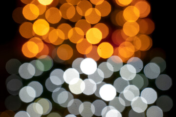 Festive Blur: Mesmerizing New Year and Christmas Lights Paint a Whimsical, Joyful Atmosphere.