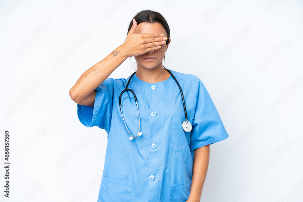 Poster Young nurse woman isolated on white background covering eyes by hands. Do not want to see something