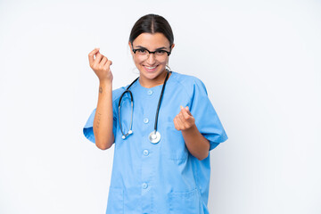 Young nurse woman isolated on white background making money gesture