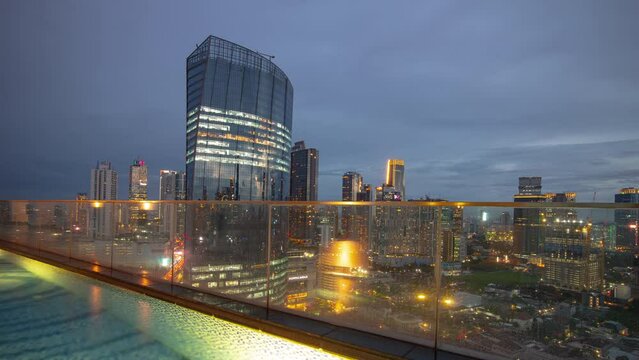 Twilight Time Illumination Jakarta City Center Rooftop Swimming Pool Panorama 4k Timelapse Indonesia