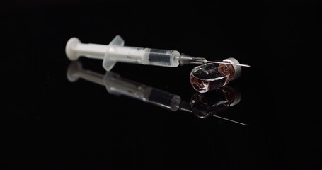 Syringe and Medicine on Black Background Isolated