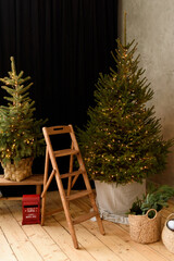 christmas tree in the room with wood chair