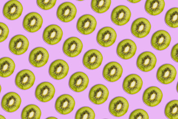 Kiwi pattern on bright pink  background. Minimal flat lay food texture. Summer abstract trendy...