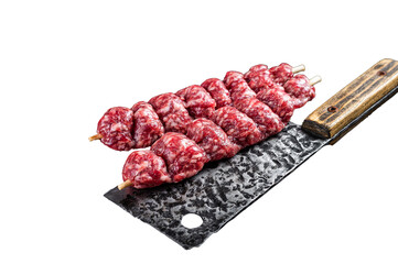 Raw beef Kofta kebab Skewers on a meat cleaver. Transparent background. Isolated.