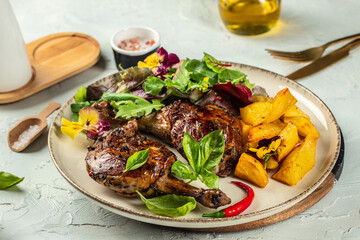 Cooked duck leg with potatoes. banner, menu, recipe copy space, top view